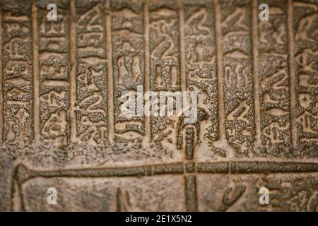 Shallow depth of field (selective focus) and close up footage with Egyptian hieroglyphs on a historic replica. Stock Photo