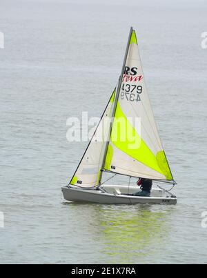 Colourful Sailing Dinghies on the North Sea  at Felixstowe Suffolk England. Stock Photo