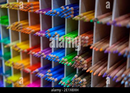Showcase with colored pencils for drawing in the store for artists or stationery Art concept background Stock Photo