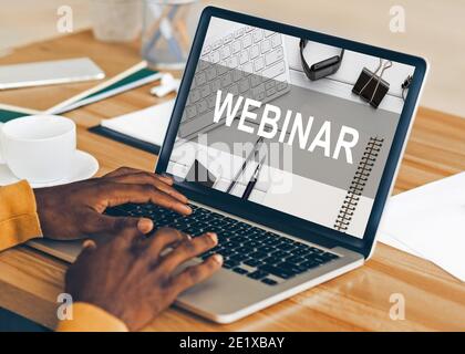 Unrecognizable african-american man having webinar on modern laptop Stock Photo