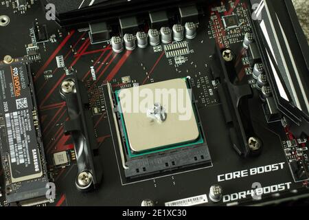 Moscow, Russia - 5 December 2020: Thermal paste on CPU. PC setting or installation, repair of computer, Illustrative Editorial. Stock Photo
