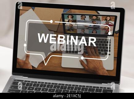 Laptop with webinar inscription on screen, creative image Stock Photo