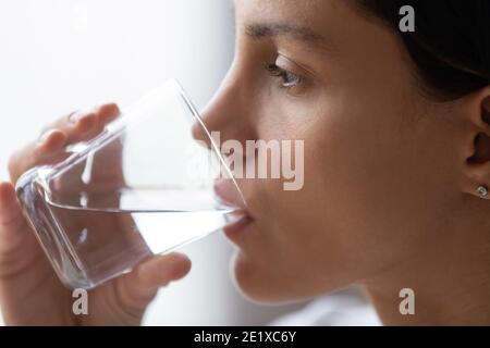 Close up beautiful woman with perfect skin drinking pure water Stock Photo