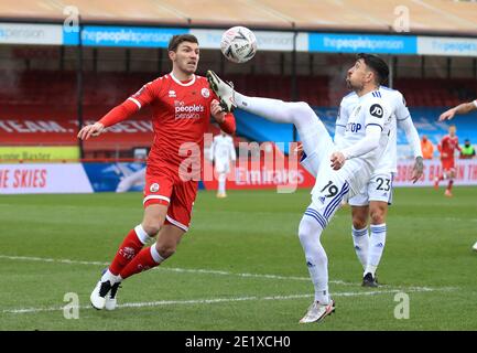Crawley Town's Jordan Tunnicliffe (left) and Leeds United's Pablo Hernandez battle for the ball during the Emirates FA Cup third round match at the People's Pension Stadium, Crawley. Stock Photo