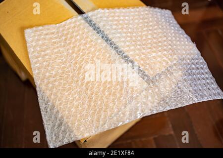 Bubble wrap on a cardboard box Stock Photo