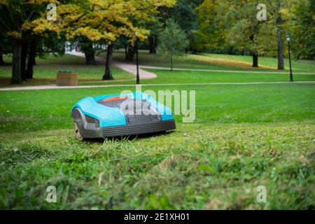 Autonomous lawnmower in a park in a smart city Stock Photo