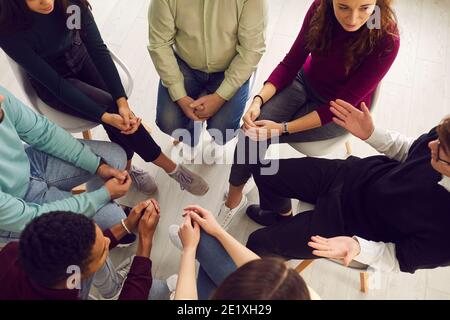 Diverse people listening to therapist, sitting in circle in group therapy session Stock Photo