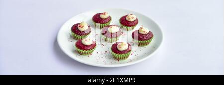 red velvet cupcakes with copy space. tasty red color cupcakes with space on both the sides of the photo. Stock Photo