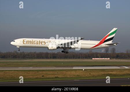 Emirates Boeing 777-300 with registration A6-EMT on short final for runway 23L of Dusseldorf Airport. Stock Photo