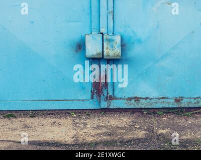 Armored lock on vintage metal door. Rusty metal frame. Security system Stock Photo