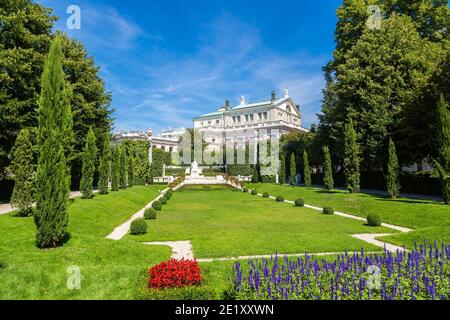 Volksgarten (People's Garden) public park and Burgtheater in Vienna, Austria in a beautiful summer day Stock Photo