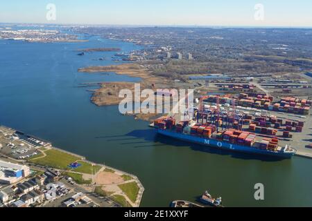 NEWARK, NJ -7 JAN 2021- Aerial view of the MOL Motivator cargo ship docked at the Port of Newark Elizabeth New Jersey. Stock Photo
