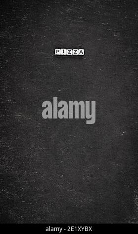 Word pizza on black stone background Stock Photo