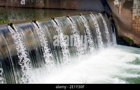 A fall of water, a mill race from a reservoir to a canal. Stock Photo