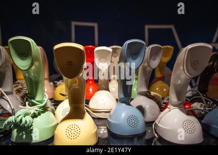 Plenty of cobra phones on a desk with a darkbackground photo: Bo Arrhed Stock Photo