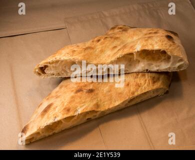 Baked focaccia - bread of sourdough - Close up of cut loaf showing the alveoli as test of gluten strengthe Stock Photo