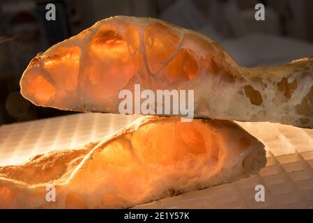 Baked focaccia - bread of sourdough - Close up of cut loaf showing the alveoli as test of gluten strengthe Stock Photo