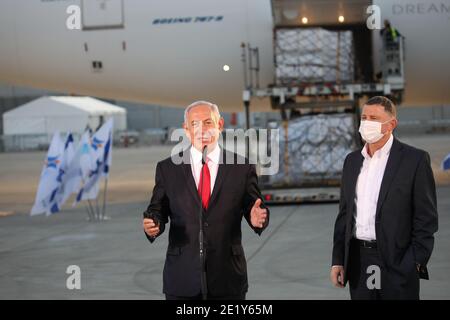 Lod, Israel. 10th Jan, 2021. Israel Prime Minister Benjamin Netanyahu (L) and his Health Minister Yuli Edelstein attend the arrival of plane with shipment of Pfizer anti-coronavirus vaccines, at Ben Gurion Airport, near the city of Lod, Israel, on Sunday, January 10, 2021. Pool photo by Motti Millrod/UPI Credit: UPI/Alamy Live News