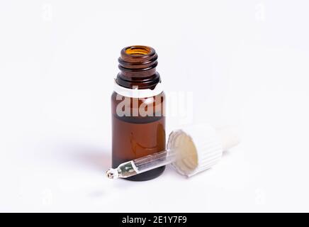 isolate, glass vial with pipette on white background Stock Photo