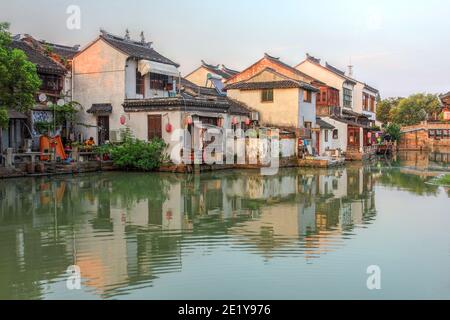 Evening scene with traditional old chinese houses along a canal in Tongli, a beautiful water town nearby Suzhou, Jiangsu province, China. Stock Photo