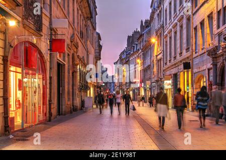 Evening atmosphere along the Grand Rue in the old city center of Besançon, France captured during a moody evening light. Stock Photo