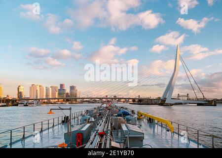 Binnenvaart, Translation Inlandshipping on the river Nieuwe Maas Rotterdam Netherlands during sunset hours, Gas tanker vessel Rotterdam oil and gas transport. Netherlands Stock Photo