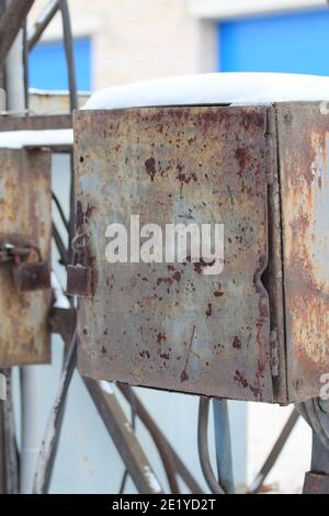 Old street metal rusty locked box for wires, equipment, tools, industrial background. Stock photo with empty space for text and design. Stock Photo