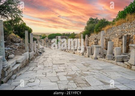 Curetes street in Ephesus Ancient City at sunset in Izmir, Turkey - October, 2020: Ancient and historical road from the roman period. Stock Photo