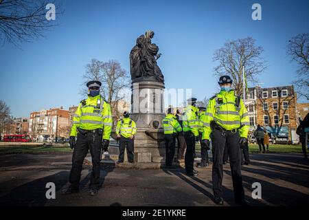 Police maintain a presence at Clapham Common during the anti-lockdown demonstration on January 9, 2021 in London, England. Stock Photo