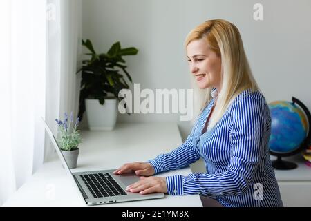 Global communication concept using video conferencing on a laptop Stock Photo