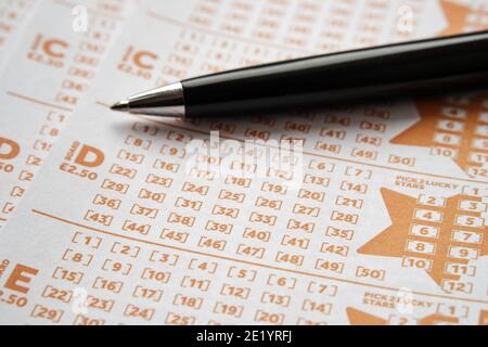 Stafford, United Kingdom - November 10 2020: EuroMillions lottery cards and pen. EuroMillions is Europe's biggest lottery. Concept. Stock Photo