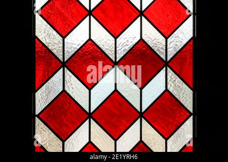 Door with red geometric stained glass elements Stock Photo