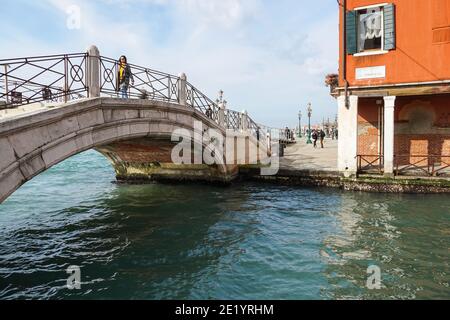 Tourists on Ponte Longo bridge in the sestiere of Dorsoduro, Venice, Italy Stock Photo