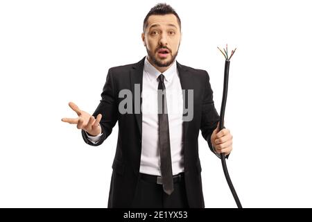 Businessman holding a broken elecrtic cable and wondering what to do isolated on white background Stock Photo