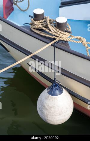 White Round Boat Fender For Motor Boat Stock Photo