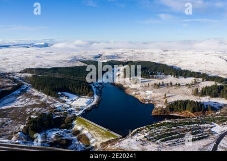 Aerial view of a cold, snow covered winter town with semi frozen lakes and ponds (Ebbw Vale) Stock Photo