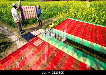 Weavers are seen polishing the threads and checking the final designs of  the Sarees before sending them to the local markets for sell.The  traditional dress of an Indian Woman is Saree which