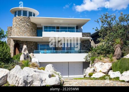 Sydney large detached coastal house in Avalon Beach with rock and green front domestic garden,Sydney,Australia Stock Photo