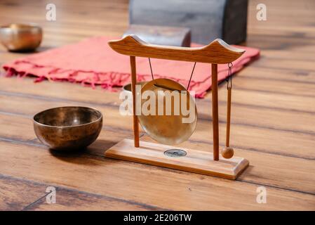 Tibetan singing bowls on the floor in yoga class, sound therapy concept Stock Photo
