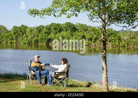Alabama Monroeville Isaac Creek Campground,Claiborne Lake Alabama River Lakes water scenery,man woman female couple relaxing toasting, Stock Photo
