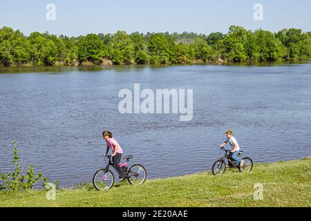 Alabama Monroeville Isaac Creek Campground,Claiborne Lake Alabama River Lakes water,girl boy bicycles riding bikes, Stock Photo