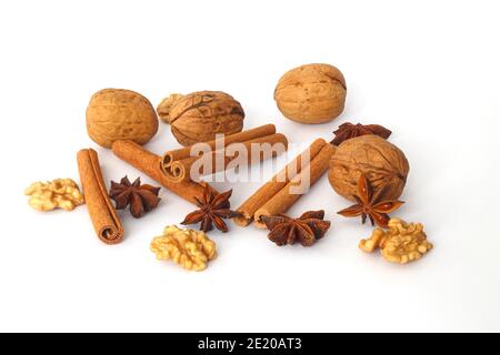 spices as cinnamon stick, anise star and walnut isolated on white background Stock Photo