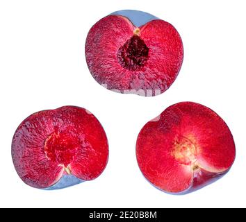 Plum fruits halves isolated on white background. Fresh Cut Plums Top view. Flat lay Stock Photo