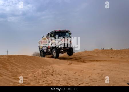 Horimlaa, Saudi Arabia - January 7, 2021: The Renault racing truck of Riwald Dakar Team running over dunes during Stage 5 of the 2021 Dakar Rally Stock Photo