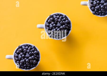 Creative pattern of blue espresso coffee cups on white background Stock Photo