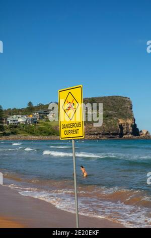 Surf rescue Dangerous current sign at a Sydney beach to warn swimmers about rips in the ocean,Sydney,Australia Stock Photo