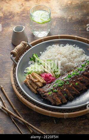 Closeup pork short ribs asian cuisine, rustic style. Stock Photo