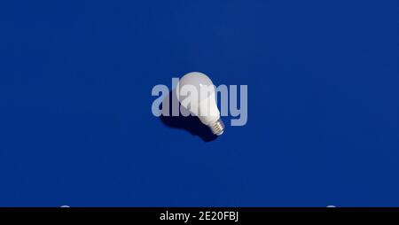 LED energy saving light bulbs on blue background. Sustainable lifestyle eco-friendly concept Stock Photo