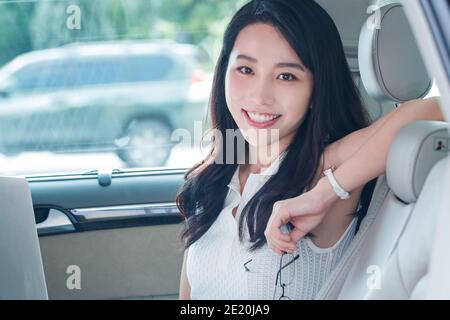 Beautiful business women sitting in the car Stock Photo