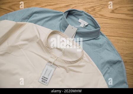 Paris, France - Jan 7, 2021: View from above of two fashionable shirts by COS Stock Photo